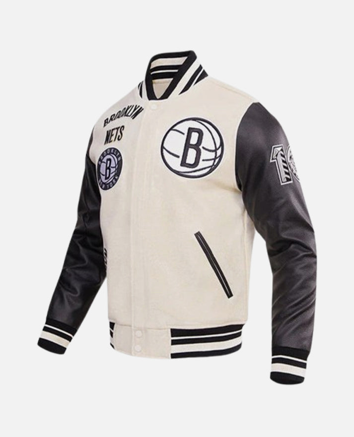 NBA Brooklyn Nets Men's Black & White Varsity Leather Jacket - collar and zip close-up