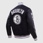 NBA Brooklyn Nets Men's Rib Wool Black Varsity Jacket - collar and zip close-up